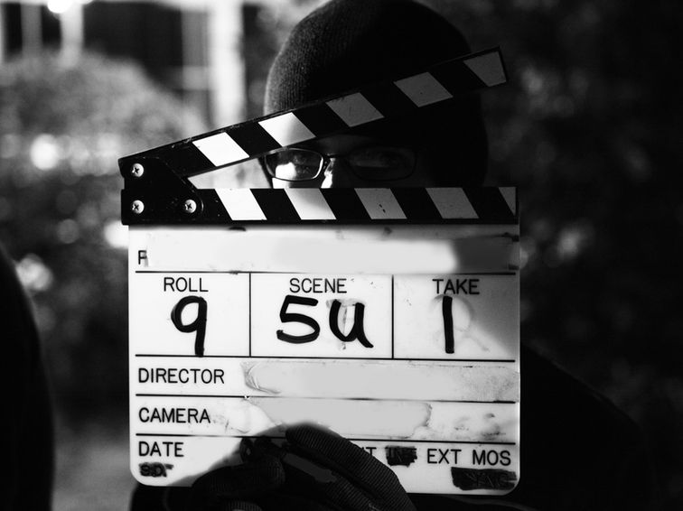 Close-up of a film slate, representing short video guides